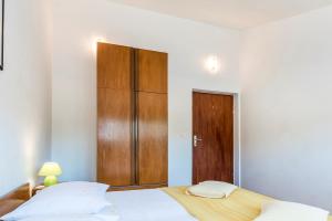 Postel nebo postele na pokoji v ubytování Apartments Žirje