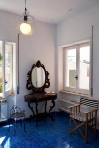 a mirror sitting on a table in a room at Two bedrooms Capri style home near Piazzetta in Capri