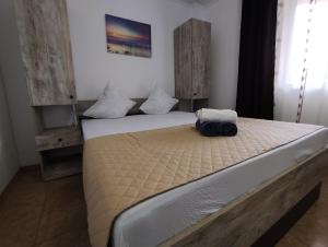 מיטה או מיטות בחדר ב-Casa Aura 1