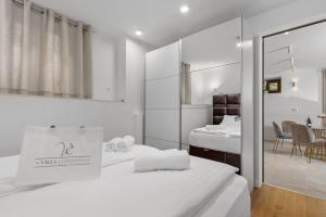 Posteľ alebo postele v izbe v ubytovaní Apartmani Đogaš