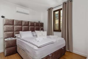 Posteľ alebo postele v izbe v ubytovaní Apartmani Đogaš