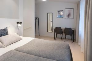 Säng eller sängar i ett rum på Forenom Apartments Stockholm Johannesgatan