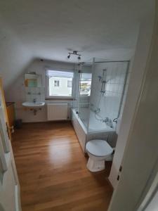 a small bathroom with a toilet and a sink at Ferienwohnung Brendle in Sankt Johann