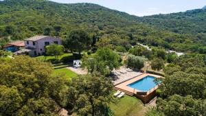 an aerial view of a house with a swimming pool at Country Relais La Mortella in Porto Ercole