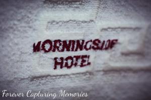 a writing on the side of a towel with the words warming up hoc at Morningside Hotel in Whitby