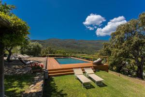a swimming pool with lounge chairs next to at Country Relais La Mortella in Porto Ercole +37 photos