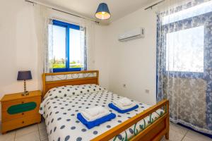 Postel nebo postele na pokoji v ubytování Villa Akti by Villa Plus