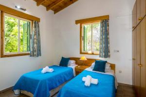 Postel nebo postele na pokoji v ubytování Villa Clymentas by Villa Plus