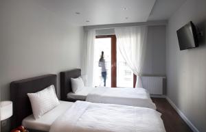 Posteľ alebo postele v izbe v ubytovaní Oxygen Residence