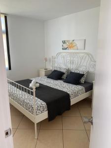 Posteľ alebo postele v izbe v ubytovaní Appartamento confortevole con piscina 7