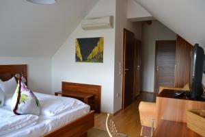 Rúm í herbergi á Hotel Villa Rosa