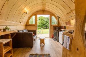 a small kitchen and living room in a tiny house at Beautiful 1 bed Glamping pod in Battle in Battle