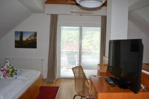 Sjónvarps- og/eða afþreyingartæki á Hotel Villa Rosa