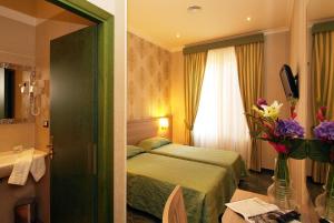 Posteľ alebo postele v izbe v ubytovaní Hotel Argentina