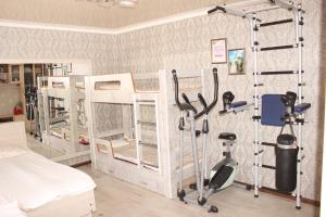 a room with several bunk beds and exercise equipment at Guest House Jamal in Naryn