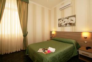 Posteľ alebo postele v izbe v ubytovaní Hotel Argentina