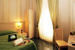 Posteľ alebo postele v izbe v ubytovaní Hotel Argentina