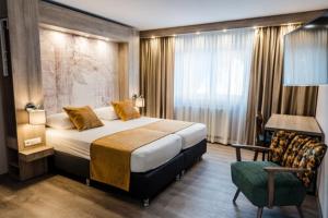 Säng eller sängar i ett rum på Liebig-Hotel