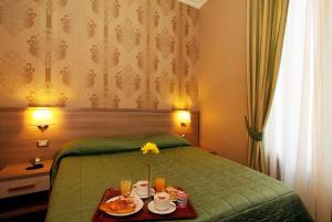 Posteľ alebo postele v izbe v ubytovaní Hotel Argentina