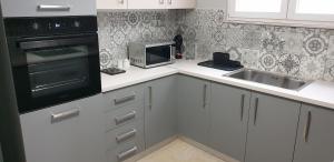 A kitchen or kitchenette at Panoramic Apartment