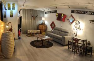 a living room with a couch and a table at Antom in Berck-sur-Mer