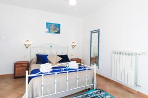 Säng eller sängar i ett rum på Villa Basilio Accommodation