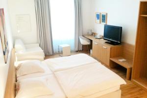 Ένα ή περισσότερα κρεβάτια σε δωμάτιο στο Hotel Simoncini