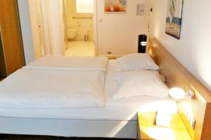 Ένα ή περισσότερα κρεβάτια σε δωμάτιο στο Hotel Simoncini