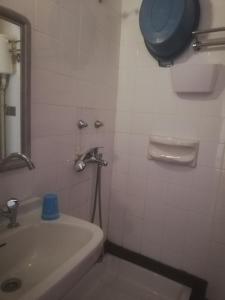 a bathroom with a sink and a toilet at Atlantis Hotel in Skala Potamias