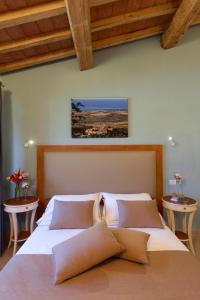 Postel nebo postele na pokoji v ubytování Resort Capalbio