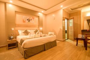 Postel nebo postele na pokoji v ubytování Abai Lodges & Spa