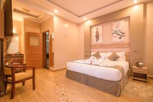 Postel nebo postele na pokoji v ubytování Abai Lodges & Spa