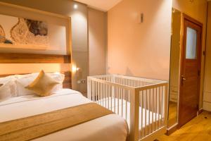 Postel nebo postele na pokoji v ubytování Abai Lodges & Spa