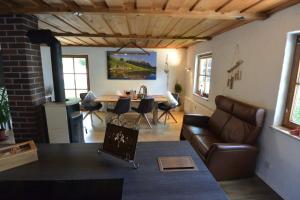 a living room with a couch and a table at Alpenchalet Karwendel in Mittenwald