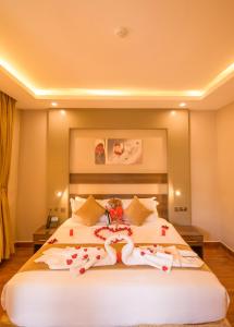 Postel nebo postele na pokoji v ubytování Abai Lodges & Spa