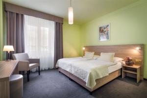 Postel nebo postele na pokoji v ubytování Atlantic Hotel