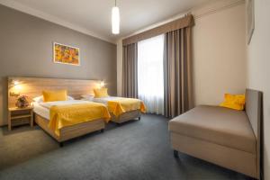 Postel nebo postele na pokoji v ubytování Atlantic Hotel
