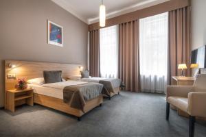 Postel nebo postele na pokoji v ubytování Atlantic Hotel