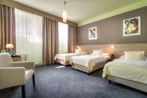 Postel nebo postele na pokoji v ubytování Atlantic Hotel
