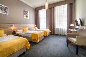 Postel nebo postele na pokoji v ubytování Atlantic Hotel