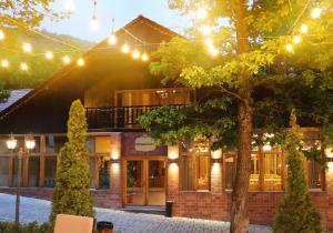 a building with christmas lights in front of it at Splendor Resort and Restaurant in Tsaghkadzor