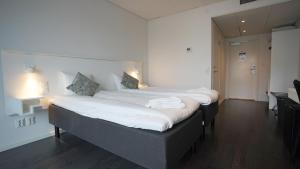 Säng eller sängar i ett rum på Forenom Aparthotel Gothenburg Nolvik