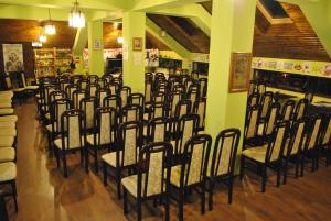 a bunch of chairs lined up in a room at Curtea Brancovenească in Constanţa
