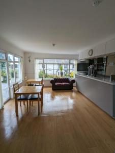 a living room with a table and a couch at Cottage Court Hotel in Tenby