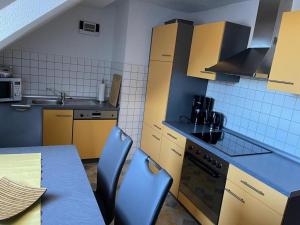 Кухня или мини-кухня в Ferienwohnung Kreft
