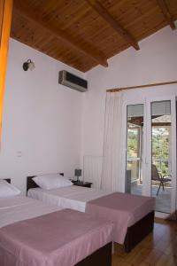 A bed or beds in a room at Villa Erofili Plakias south Rethimno Crete