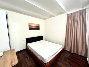Ένα ή περισσότερα κρεβάτια σε δωμάτιο στο Nice apartment close PARK GÜELL 2