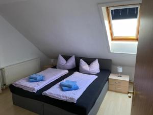 Кровать или кровати в номере Ferienwohnung Kreft