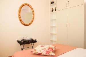 A bed or beds in a room at Katerina's Luxury Apartment