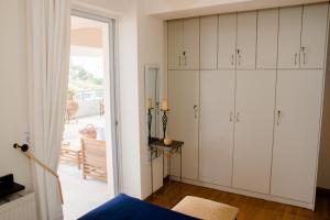 A bed or beds in a room at Katerina's Luxury Apartment